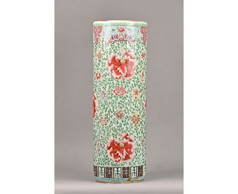 A Chinese famille-rose cylindrical stick stand, circa 1900, colourfully painted with flowers and green tendrils, 66cm. high. 