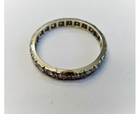 A diamond set full eternity ring, mounted with a row of circular cut diamonds, ring size N, with a case.