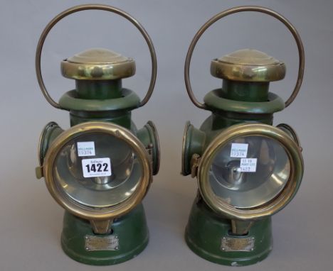 A pair of 4 inch Lucas 'King of the Road' green painted brass cased automobile oil lamps. (2) 