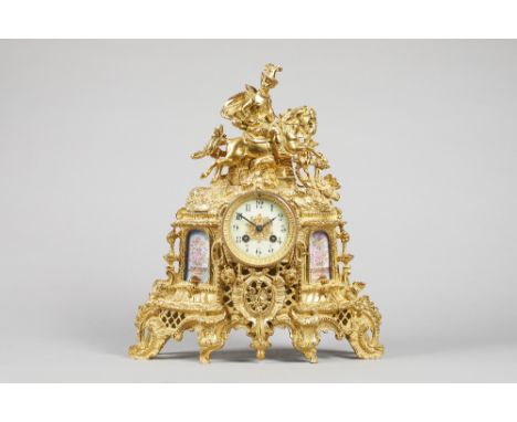A French giltmetal and porcelain-mounted mantel clockCirca 1880The case modelled with an equestrian figure above the glazed c