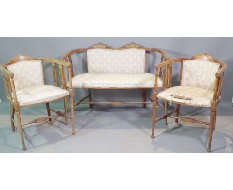 An Edwardian mahogany inlaid salon suite comprising a sofa ,102cm wide and two open armchairs, (3). 