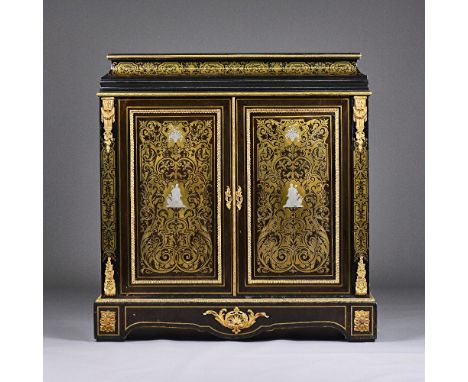 A Victorian brass and pewter inlaid gilt metal mounted ebonised side cabinet, the caddy top over pair of doors on shaped plin