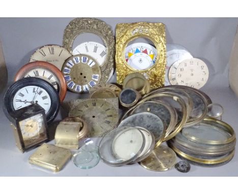 A large group of longcase and dial clock fixtures, glazed bezels and sundry, (qty).