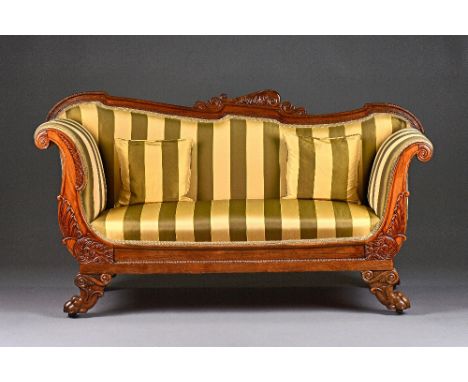 A William IV rosewood sofa, with shaped crest rail and outswept arms on lion's paw capped scroll sabre supports, 173cm wide x