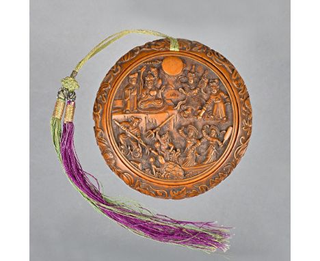 A Chinese circular shallow wood box and cover, 19th century, the cover well carved with a figurative panel, the box carved wi