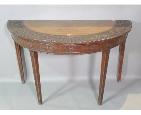 A 18th century style carved mahogany console table on tapering supports, 117cm wide x 78cm high. 