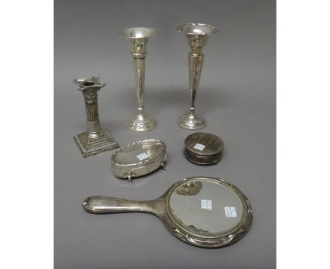 Silver and silver mounted wares, comprising; a Corinthian column candlestick, height 15cm, Sheffield 1911, two vases, an oval