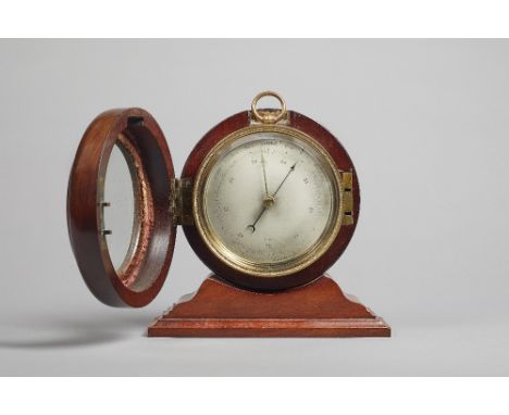 A Victorian mahogany-cased brass aneroid barometerNo. 12182The 4 1/4in. circular silvered dial, within an engine-turned bezel