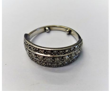 A diamond set half hoop ring, mounted with three rows of circular cut diamonds, ring size L, (note arthritic bobbles).