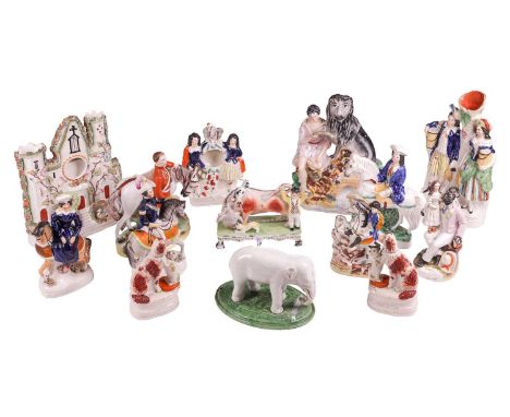 A large collection of Staffordshire figures, to include an elephant, a bull-baiting group, Daniel and the Lion, Admiral Sir C