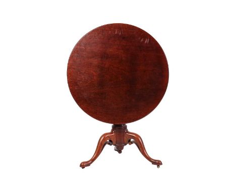 An early George III "Plum Pudding" mahogany circular snap top tripod table, with boarded birdcage action over a heavy gun bar