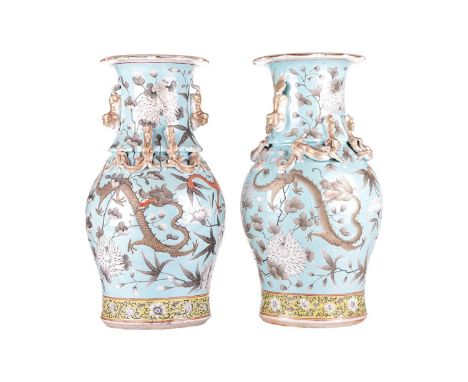 A pair of Chinese Canton porcelain baluster vases, Qing Dynasty probably Tongzhi (unmarked), each with petaled everted rims, 