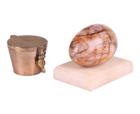 A large Derbyshire fluorspar 'Blue John' egg hand cooler, early 19th century, mounted on a white marble stand. 12 cm long x 8