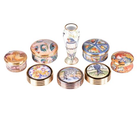 A collection of eight Moorcroft enamel items, in original boxes, to include two gilt paperweights, a limited edition 'Safari'