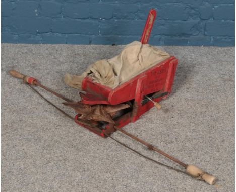 A vintage seed sower. Stencilled "The Aero Broadcast Seed Sower".  