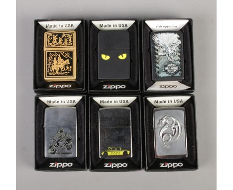 Six vintage Zippo used lighters in original boxes including Harley Davidson, New York Taxi, Dragon, etc.  