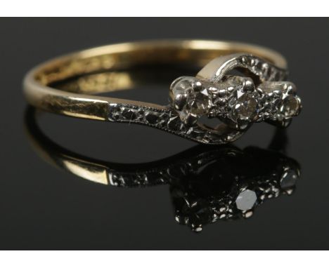 An 18ct gold, platinum and diamond ring. Size P. 2.82g.  