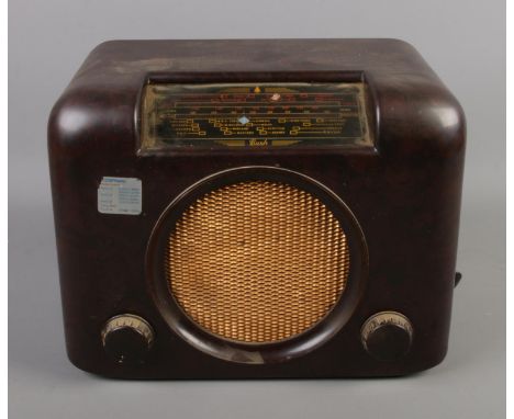 A vintage Bush bakelite radio. Serial No 73/99211.  Case not cracked. Paint splat to one side. Power lead missing.