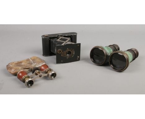 A pair of miniature opera glasses in purse, together with a Kodak pocket camera and binoculars.  