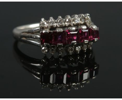 An 18ct White Gold, Ruby and Diamond three row ring. Size M. Total weight: 3.8g  
