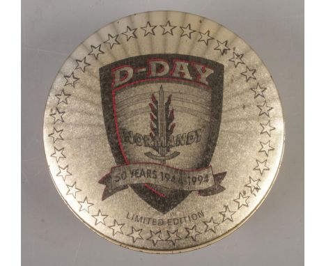 A 50th Anniversary of D-Day Normandy Zippo lighter in fitted tin; the lighter with applied D-Day Normandy shield.  