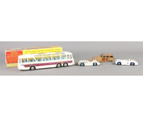 Four vintage Dinky die-cast vehicles. To include boxed 952 Vega Major, 133 Cunningham x 2 and 344.  One example of 133 in goo