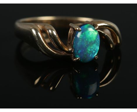 A 9ct Gold and Opal doublet ring; size MÂ½. Total weight: 2.9g.  