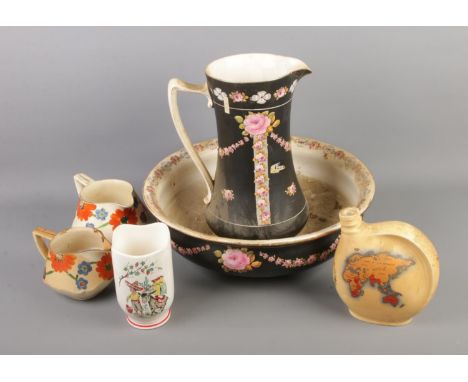 A quantity of Crown Ducal including King George VI coronation wine flask, washbowl and jug, floral jugs and Mexican vase.  