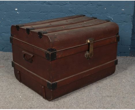 A vintage tin trunk.  