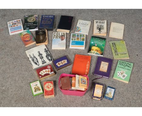 A large collection of playing cards, tarot card and fortune telling guides. To include I Ching cards, Rider Waite tarot cards