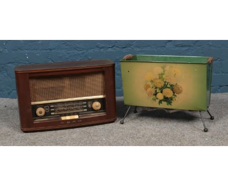 A vintage bush radio along with floral magazine rack.  