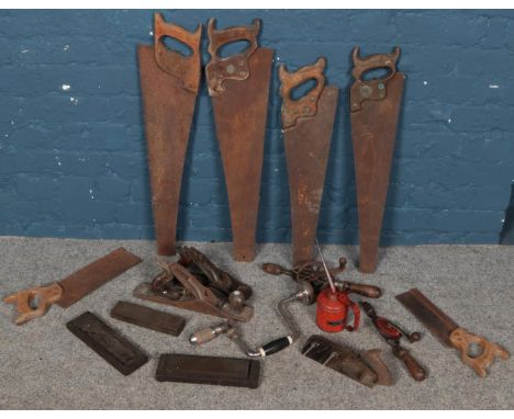 A box of vintage hand tools. Including Stanley planes, saws, Wesco oil can, etc.  