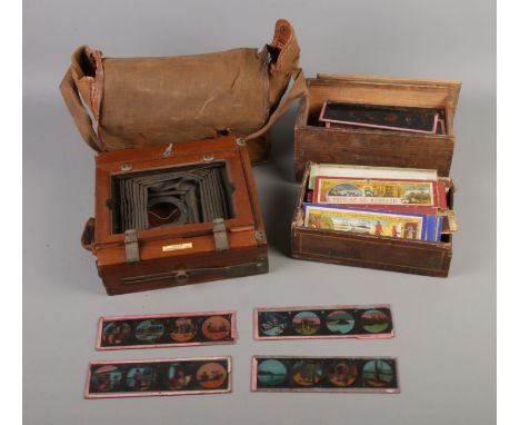 A quantity of Magic Lantern slides including Heroes of the Victoria Cross, Dogs of St. Bernard, Aladdin, etc. Also includes T