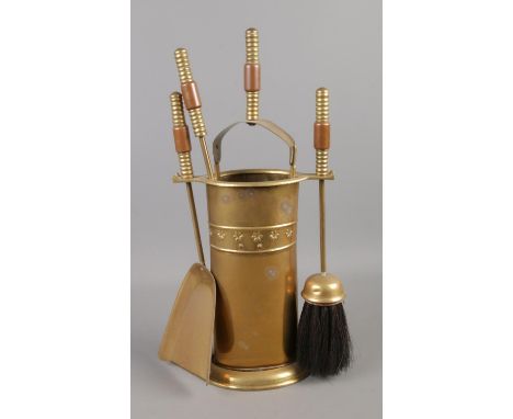 A brass fireplace companion set.  