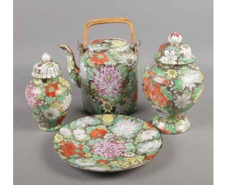 Four vintage pieces of Chinese ceramics. Includes lidded vases, dish and teapot.  
