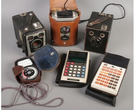 Three Kodak Brownie cameras and a Weston Master III light meter. Includes Reflex, Model C, etc.  