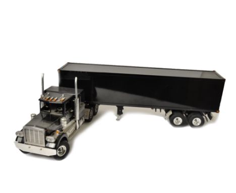 Wedico Remote Control Peterbilt Truck, an unboxed constructed model of a Peterbilt American truck and box trailer in black li