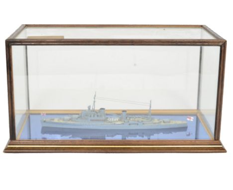 A fine detailed model of HMS 'Newfoundland' constructed in metal with full detail, presented in a glass display case with woo