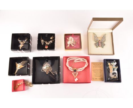 A collection of Butler &amp; Wilson boxed jewellery to include five brooches, a stags head, cocktail glass, butterfly, Americ