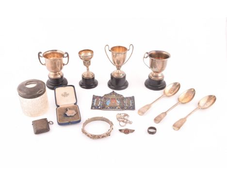 A collection of assorted silver items including four miniature trophy cups on stands, three 19th century silver spoons, a sil