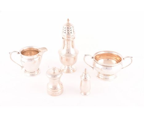 A collection of silverware, including a George VI silver creamer and sugar bowl, both with full hallmarks for London 1937 by 