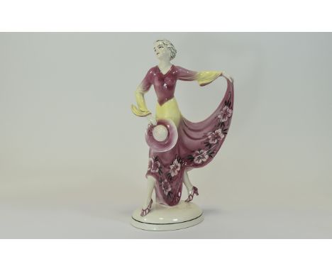 Katzhutte Art Deco Ceramic Figurine of a Young Lady In 1930's High Fashion Dress, Hat and Shoes In a Dancing Pose. Height 10 