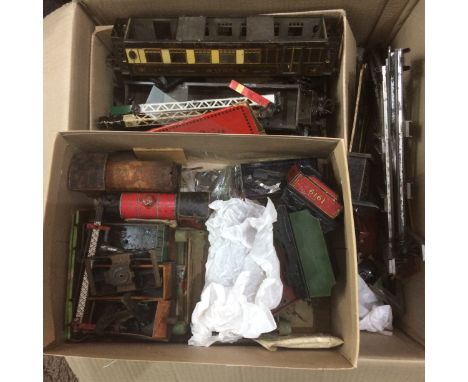 A Large Collection Of 1920s/ 1930s tin plate model railway items.  Various gauges including wagons and coaches, mostly O-Gaug