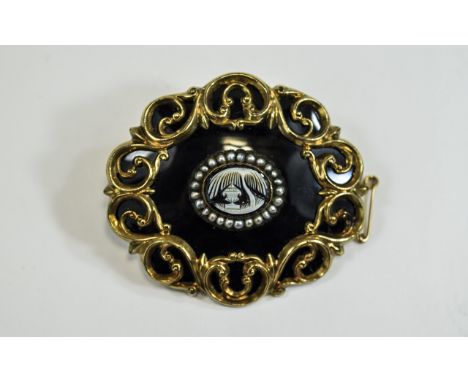 A Finely Worked and Well Made Victorian Black Enamel and Pinchbeck Oval Shaped Mourning Brooch with Attached Gold Safety Chai