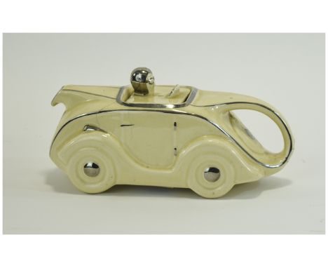 Sadler Novelty Teapot In Form of Racing Car Cream and silver glazed teapot in shape of 1930's racing car with driver in helme