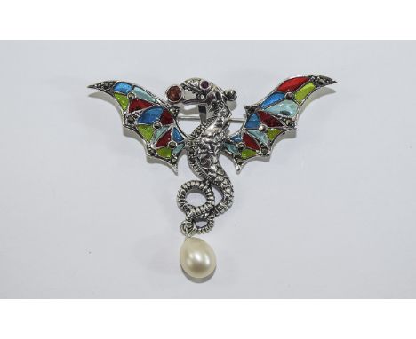 Silver Enamel Dragon Brooch Unusual whiplash shaped dragon brooch in silver with pearl drop. Enameled wings in green, blue an