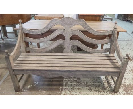 GARDEN FINIAL BENCH, weathered teak, slatted with double arched back and swept arms with finials by 'P J Bridgeman &amp; Co E