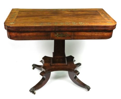 A Regency rosewood and cut-brass card table, the hinged 'D' shape fold over top with a border of foliate motifs, on a rectang