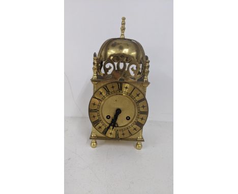 A brass eight day mantle clock in the style of a 17th century lantern clock by St JamesLocationIf there is no condition repor