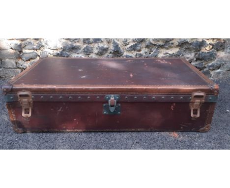 Louis Vuitton- An early 20th Century Louis Vuitton travel trunk, serial no:142412, having chestnut brown leather exterior, st